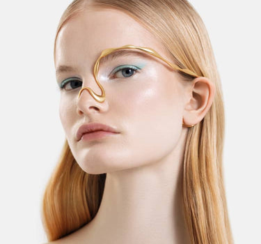 organic-shaped face jewelry in gold