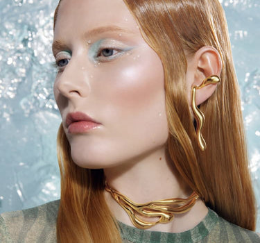 gold liquid earrings that hook around the ears