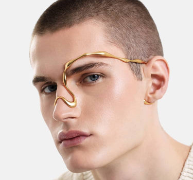 organic-shaped face jewelry in gold