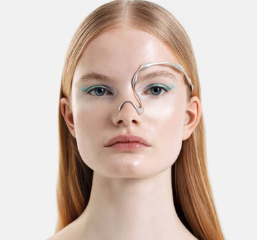 organic-shaped face jewelry in silver