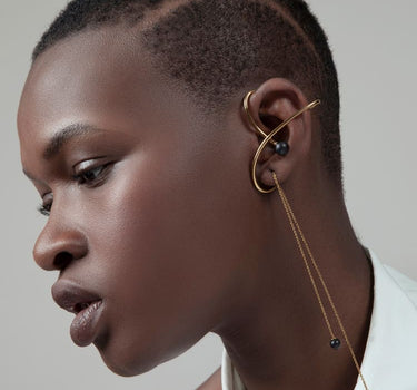 Gold ear cuff with earrings and sandal stone