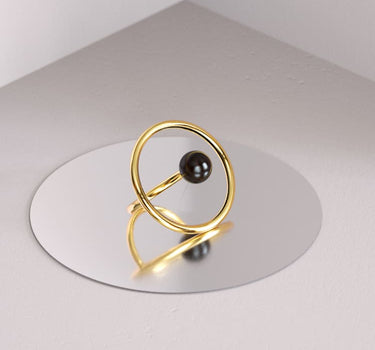 Gold ring with black sandal wood stone